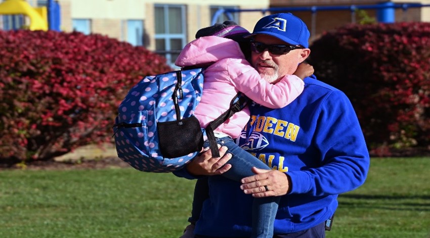 High School Athletes Greet Elementary School Students to Start Their Day